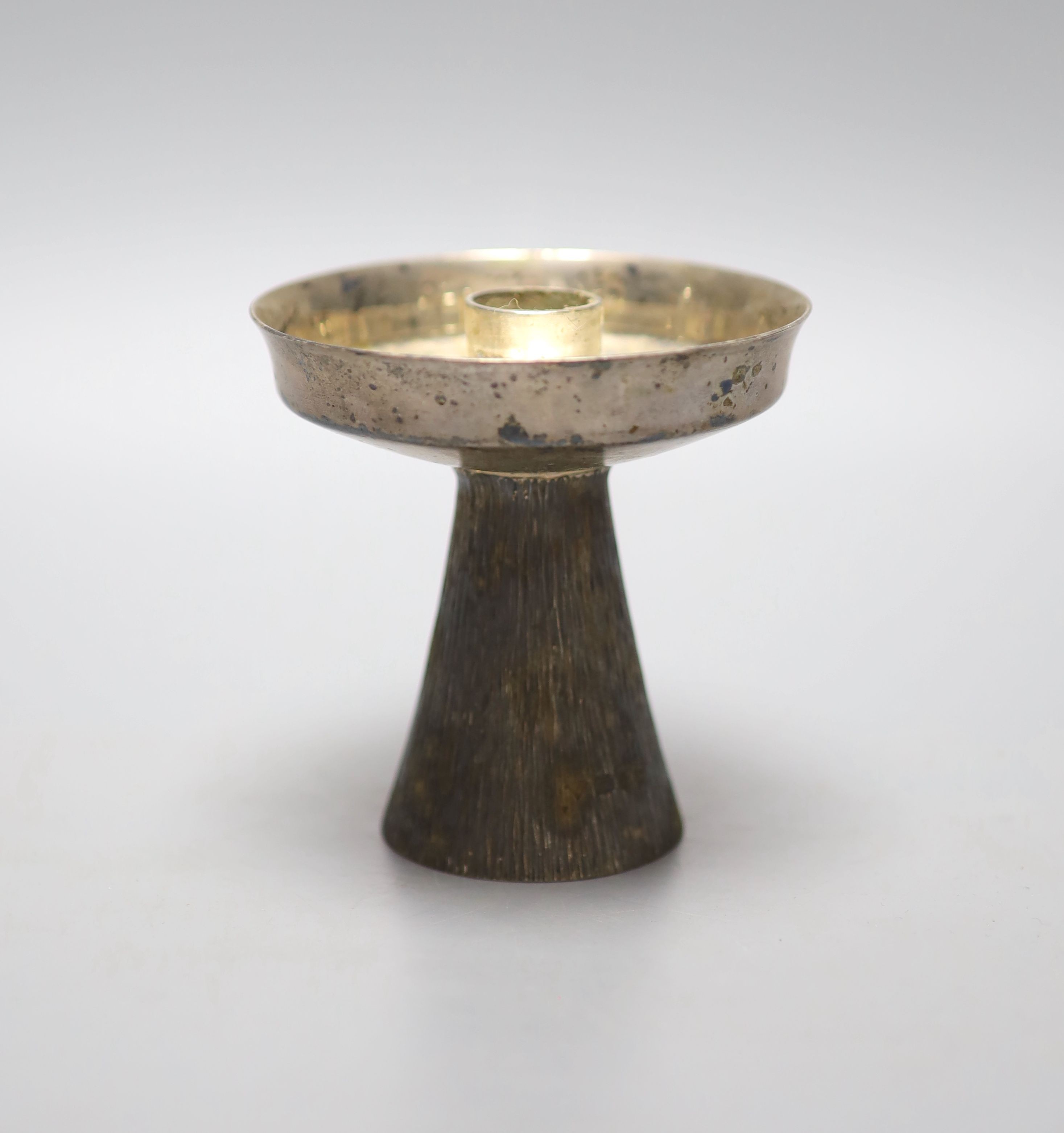 A modern part textured silver candlestick by Brian Leslie Fuller, London, 1985, 88mm, 177 grams.